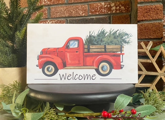 Festive Christmas Welcome Sign with Red Truck and Tree